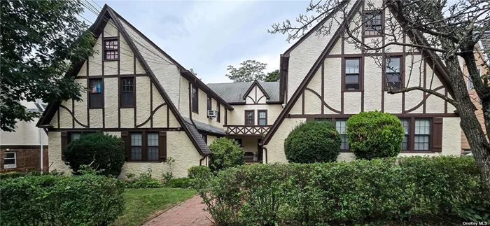 Remarkable Tudor-Style 8-Family Rent Stabilized Property in Douglaston, NY Nestled in the picturesque enclave of Douglaston, this hidden gem offers a unique investment opportunity. This legal 8-family Tudor-style building is perfectly positioned just a short distance from the LIRR and Northern Blvd, providing convenient access to transportation, shops, schools, and places of worship. The property features a mix of 4 one-bedroom and 4 two-bedroom units, The building boasts a detached 6-car garage. A solid consistent income with lease. Four doors/entrance with two units each. . Key updates include a gas boiler installed less than three years ago, as well as a younger roof and windows. Each unit is adorned with beautiful hardwood floors, and second-floor units offer additional storage space with access to the attic. The basement is dedicated to utilities, ensuring easy maintenance. Set on a large, flat lot, this property combines historical charm with modern convenience, making it an attractive option for investors and residents alike. Selling As Is with tenants. Please respect tenants. Public transportation including LIRR nearby, house of worship and shopping.