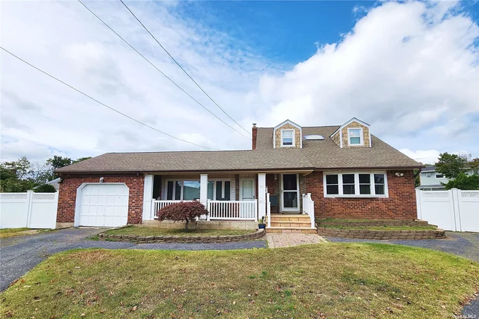 Nestled in a tranquil cul-de-sac in Northeast Hicksville. This Expansive 5-bedroom, 3-bath brick and frame expanded cape on a generous 8, 010 sqft lot. This home boasts a recently renovated kitchen with granite countertops, a modern tile backsplash, tiled flooring, and a stainless steel refrigerator. The open-concept design seamlessly connects the living room, dining room, and kitchen, creating an ideal space for daily living and entertaining. A spacious den/family room leads out to a large patio and an impressively oversized backyard, perfect for outdoor gatherings. The fully finished basement offers versatile space with endless possibilities and includes convenient egress to the backyard through a separate entrance. Two private driveways, one leading to an attached garage, ensure ample parking. Home is conveniently located near Broadway Mall, Plainview Shopping Center, Woodbury Plaza, Hicksville LIRR Station, Northern State Parkway, and the LIE/495.