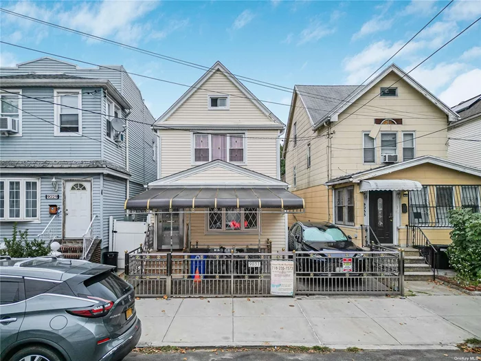 Welcome to this spacious and well-maintained single-family home in the heart of Woodhaven, Queens. Boasting 5 bedrooms and 3 full baths, this home offers an abundance of living space across three levels. Upon entering, you&rsquo;re greeted by a large foyer leading to a versatile room perfect for a home office, followed by a modern 3-piece bathroom with a stand-up shower, a cozy living room, and a beautifully designed kitchen with granite countertops and a dining area. The second and third floors provide ample private space with 5 bedrooms and another full bath, while smart toilets and mirrors enhance all bathrooms for a touch of luxury. The fully finished basement, with two separate entrances, features 3 additional rooms, a laundry room with a kitchenette, and a full bath-ideal for extended family or guests. Comfort is guaranteed year-round with central A/C, supplemented by split units throughout the house. The long driveway leads to a paved backyard with a prune tree, and the 2-car garage has been finished with tiling, electrical work, and its own heating and cooling system, creating the perfect extra living space. A charming front patio with an awning adds outdoor relaxation. Conveniently located near J, Z, and A trains on Jamaica and Liberty Avenues, major shopping centers, supermarkets, banks, and public transportation, this home is perfect for those seeking space, comfort, and convenience.