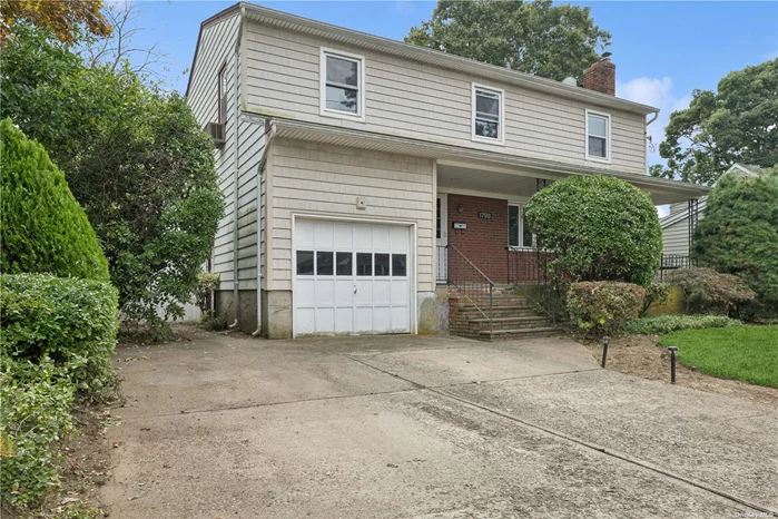 Merrick 4 Bedroom colonial, Bedrooms are all good sizes. Formal Living Room with wood working Fireplace. Family Room with Full Bath, Eat in Kitchen with Granite Counters.  Hardwood Floors. Attached 1 car Garage with Driveway for at least 2 cars. Schools, Shops are all close. Show and Sell