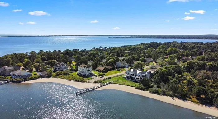 Architectural masterpiece situated on 175&rsquo; of private sandy beachfront on the south side of the peaceful Shinnecock Bay. Experience this custom-built in 2019 waterfront gem which sits on 0.76 acres offering an expansive 175 of water frontage and a new 136&rsquo; dock. The magnificent open-concept residence boasts 5, 586 square feet home which brings functionality, versatility and luxury together. The inside wonderfully connected to the outside has a newer infinity edge pool and spa, custom copper chimney, mahogany deck with custom cable railing system and the blue stone veranda is steps from its own private beach. An impressive property with 5 bedrooms, 5 bathrooms and 2 half baths as well as a 2 car garage. Take in breathtaking panoramic water views from almost every window, an eastern-facing property allows for morning sunrise. Enjoy water activities from your private dock and beach and conveniently located south of the highway close to world-class restaurants.