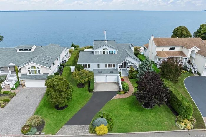 Waterfront luxury awaits at this stunning four-bedroom, four-bath home in the exclusive Oak Point community of Bayville on Long Island&rsquo;s North Shore. Blending contemporary elegance with beach town charm, this home offers expansive, unobstructed views of the Long Island Sound, just 30 miles from Manhattan and halfway to the Hamptons. Rarely will you find a home with such a perfect combination of panoramic water views nestled on a cul-de-sac within a private community complete with private beach access. Bayville&rsquo;s tranquil coastal setting offers a perfect balance of serenity and accessibility, with a small-town feel, sandy beaches, and the convenience of nearby upscale dining and boutique shopping. Some of the homes features include radiant heated floors, a generator, a heated driveway, designer Italian tiles, quartz countertops and quartz fireplaces, and custom glasswork throughout to maximize the breathtaking water views. Two primary suites, each with a custom-built walk-in closet and spa-like bath, provide ultimate luxury, while natural light and water views pour in from oversized windows. Ideal for entertaining, the home boasts three fireplaces, an all-season room, a deck with a pergola, and an in-ground heated pool, all of which come together for seamless indoor-outdoor living. This is more than a home-it&rsquo;s a chance to experience a lifestyle of privacy, luxury, and waterfront tranquility in one of Long Island&rsquo;s most desirable communities. This home has everything anyone could possibly want whether as a summer getaway or a primary residence. Claim this extraordinary property and make it your own personal sanctuary. This home is NOT in a flood zone.