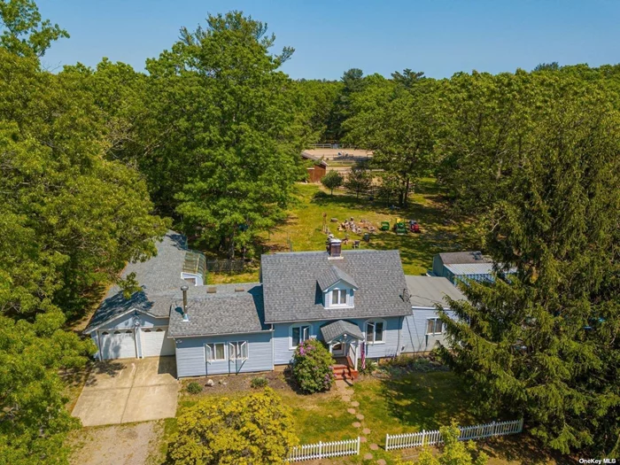 Charming Horse Property with Cottage on 2+ Acres Next to Rocky Point Preserve! This scenic 2+ acre property offers a mix of country charm and equestrian amenities. The Expanded Cape, built in 1944, includes a cozy eat-in kitchen, formal dining room, family room, and a first-floor master bedroom, along with two more bedrooms upstairs. Hardwood floors, a partially finished basement with a den. A separate 1-bedroom cottage with a living room, kitchen, and new bath offers guest or rental potential. Equestrian highlights include a 4-stall center aisle barn, turnout paddocks, run-in stalls, round pen, and sand riding ring. Stalls have in and out access. This is a must see!