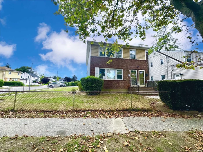 Explore this two-family home in Hempstead, boasting eight bedrooms and three bathrooms across both units. Fully occupied, these apartments generate a steady $5, 400 monthly income. Significant updates include new windows, roof, siding, renovated kitchens, and bathrooms, complemented by new carpets and a boiler installed just two years ago. Enjoy added convenience with a full finished basement for additional space and a private driveway. A storage shed in the backyard enhances utility. Located near essential amenities and transport links, this property offers a blend of suburban comfort and significant investment potential. **House being sold with tenants**