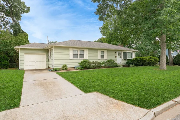 Discover the perfect canvas for your dream home in this inviting, well-kept 3-bedroom, 1-bathroom ranch. This property offers hardwood floors and a cozy wood-burning fireplace, creating a warm and welcoming atmosphere as well as large window anchoring both ends of the living space allowing for plenty of natural light. The full basement offers incredible potential for customization, whether you envision a recreation room, home office, or additional storage space. The attached garage adds convenience for daily living. Step outside to your large, serene backyard, complete with a newer Trex deck (2021) -great for entertaining. Convenient to major roadways, shopping and the Long island Railroad. This home is a wonderful opportunity to personalize and enhance according to your style, it also includes many important updates! Don&rsquo;t miss out on this gem! Star Savings $ 1231.04