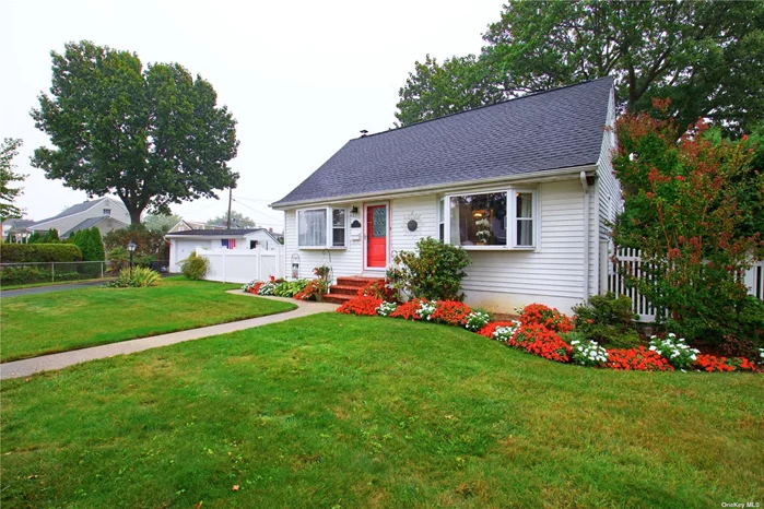 Welcome to this charming and picturesque, 4 bedroom, 1 bath, Miller Cape style home, situated in the coveted Island Trees school district and boasting over 9500 sq. ft. of beautifully landscaped property. The newer front door opens into the inviting living room with a large bay window that offers an abundance of natural sun light. The Eat-In Kitchen has a dining/breakfast bar with cabinet space below, a built -in corner cabinet, and high hat lighting . Newer appliances include a stainless steel Samsung microwave, dishwasher, and gas stove. Down the hallway is the primary bedroom which also has a sunny bay window, large closet, and is located just opposite the main level bath. Completing this floor is the second bedroom with sliding glass doors out to the deck, which could alternatively be used as a dining room, den, or office. The second floor has two additional bedrooms with ample closet and storage space.  The finished basement has a large rec room with a traditional full bar, a separate utility room with washer/dryer, and plenty more storage space. Stepping outside, the sprawling yard is fully fenced with an abundance of colorful foliage, very private, and meticulously maintained. The garage is oversized, on remote, and has a separate entrance. Close to schools, shops and restaurants, this is the ideal place to call home!