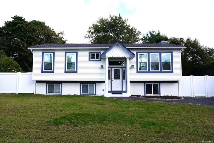 Located at 2609 Kane Ave., Medford, NY 11763, this raised ranch home offers 4 bedrooms and 2 full baths, with a spacious 2, 060 sq. ft. of living space. The upper level showcases oak flooring throughout, a modern kitchen with cherry cabinets, granite countertops, stainless steel appliances, under-cabinet lighting, and vaulted ceilings. The dining room and living room provide ample space for gathering, with triple pane front windows and double pane rear windows, all replaced this year. Renovated in 2013, the home features updated roof, siding, kitchen, baths, and flooring. The bathrooms are elegantly tiled, with granite sinktops for a polished look. The fully fenced vinyl backyard offers privacy, complemented by a large shed and a deck accessible from the den, making it perfect for outdoor relaxation or entertainment. The den is exceptionally large with abundant natural light from numerous windows, ideal for family gatherings. The lower level, which includes 2 bedrooms, a full bath, and a laundry/utility room, offers the potential for a mother-daughter setup with proper permits, and even has an outside entrance. Recent updates to the home include a new water main, septic system, freshly tiled flooring on the lower level, seal-coated driveway, and freshly painted interiors. The wall unit in the den is included with the home. With low taxes of $10, 611 and the home in pristine, diamond condition, this property is virtually maintenance-free.  A rare find, this home combines modern updates with timeless features, offering comfort and convenience in the heart of Medford.