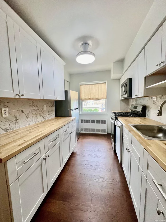 Excellent 2 bedroom apartment with this huge living room , dinning room , new kitchen , king size master bedroom , hardwood floor recently done , lots of closets , great location , easy street parking , walking distance supermarkets and transportation .