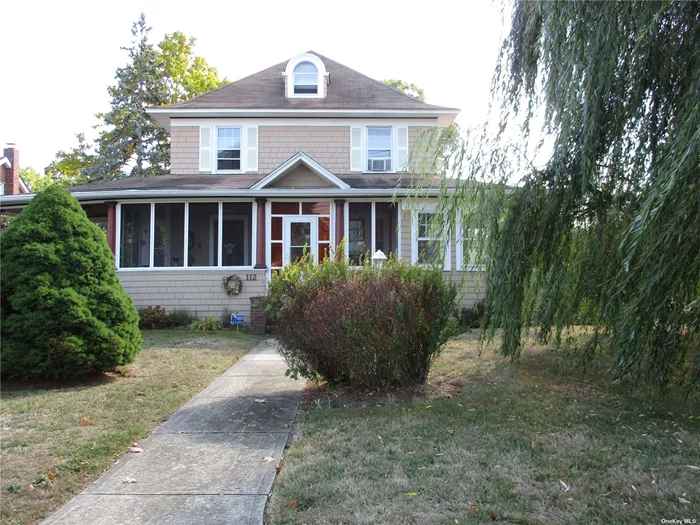 Charming and well maintained 4 Bedroom 1.5 bath Colonial built in 1912! Living room open to Large, Formal Dining Room. Eat in Kitchen with Granite Island, laundry room, pantry, Walk-up Attic, full unfinished basement, front & side enclosed porches, carport, Detached 1 Car Garage. Generous corner, fenced lot. Walk to Village restaurants, Schools, public transportation!