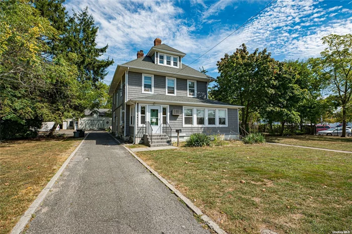 Circa 1918 home with an additional detached cottage in the rear. This Colonial home is 3, 444 sq.ft and has 6 bedrooms and 3 full bathrooms with newer siding and windows. The cottage in the rear of the property includes 2 bedrooms and 1 full bath with an attached 2 car garage. Awesome opportunity to own a piece of property in the newly developed downtown Bay Shore.