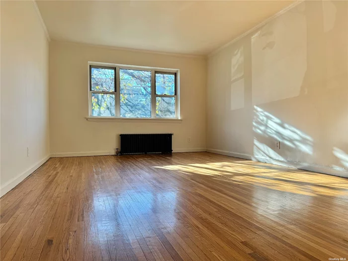 A Spacious And Bright 2 Bedroom 1st Floor Apt In Flushing. It Features Living Room, Dining Room, A Large Eat-in Kitchen, 1 bathroom, A Storage space In Unit. Hardwood Floor Throughout. Heat Included in Rent. No Parking/Easy Street Parking. Close to Highway, Queens Bus Stop ( Q65 ), Shopping Area And St. John University.