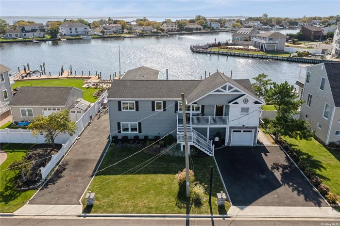 Waterfront living at its finest! This fully remodeled two story home features custom designer finishes throughout all while showcasing breathtaking water views from every room and exceptional exposure! Step into the heart of the home, where a stunning kitchen awaits, equipped with top-of-the-line Viking appliances and an oversized quartz island. The open floor plan leading into the family room and dining area make this space perfect for at home entertaining! The expansive deck and covered patio invite you to unwind and enjoy outdoor entertaining against the backdrop of serene waterfront vistas. With a private dock that accommodates up to 3 boats and easy access to the open bay, this property is a paradise for water lovers. Located in the desirable American Venice community, this home combines luxurious living with an idyllic setting. Don&rsquo;t miss your chance to make this waterfront haven your own!