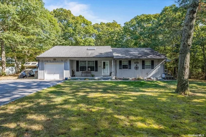 This peaceful 3-bedroom, 2-bath ranch sits on a private 1-acre flag lot. The home features spacious rooms, hardwood floors, central air, an updated bathroom, and a large eat-in kitchen. A finished basement provides extra space for guests or extended family. Zoned for horses, this serene property is a must-see!