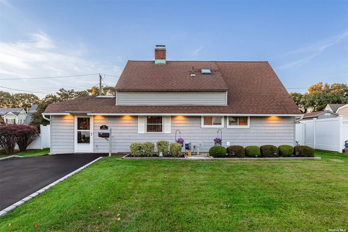 Welcome home to this meticulously kept Levitt Cape renovated for enjoyable modern living. First floor boasts a large living room flanked by a beautiful kitchen leading to a first floor bedroom with a large closet and laundry room. A full bathroom with a formal dining room finish off the first level as you make your way upstairs to a half bathroom with two additional bedrooms. Private backyard setup for entertaining and relaxing!