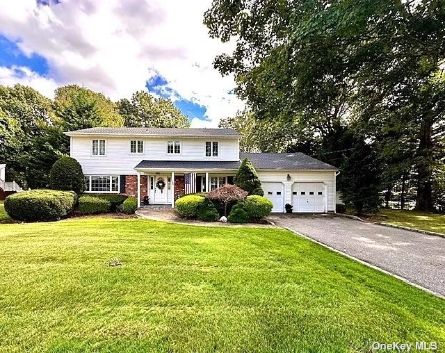 Mint Center Hall Colonial in the Sought After &rsquo; college streets&rsquo; off Washington Ave. Beatuiful 3/4 acre with lots of privacy. Oak flooring, new heating, Front Porch, Elegant Foyer, updated EIK w glass doors to deck. Desirable Main level Mud/Laundry Room. Andersen Windows, Great floor plan for all your daily needs and perfect for entertaining. Formal Lr & Dr , Den w fireplace. Move right in or make this home your masterpiece.  Primary BR has huge walk in closet & full bath. Lovely Basement for all your needs. Large 2 Car Garage. Enjoy the highly rated Plainview Schools.  This home is Convenient to all.