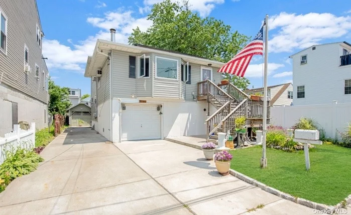 Welcome home to the Bay Park section of East Rockaway! Watch the sun rise and set overlooking Hewlett Bay! This raised split style home has an open concept including many new updates. Starting in the driveway, up the stairs and into this home you will find the living and dining room as well as updated kitchen. As you continue past the kitchen you will find 3 spacious bedrooms and a full bathroom. Walk back downstairs and you find a finished open area complete with a Landry room & full bathroom. This area has plenty of room for mom or extended guests. Continuing to the rear of the home you will find an enclosed patio to the outside entrance and into the backyard.  Outside you will find a rear deck, detached garage and a private driveway. Upgrades include a new hot water heater, updated boiler, updated roof and solar panels and updated kitchen and hardwood floors. The raised space under this home includes a 1 car garage as well as ample storage. Bay Park residents have exclusive rights to many amenities including Boat slips, boat dock space ( first rights) Activities including lighted tennis and basketball courts as well as lighted multi purpose turf fields for baseball, football, lacrosse and soccer. Picnic area, pool, spray park and new playground for children. Dog run for large and small dogs. Golf course, putting green, community room and more!