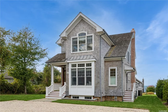 Jamesport, North Fork: views of and moments to beautiful Northville Beach, no expense spared in the building of this exquisitely crafted Nantucket-inspired home - 6 years young and features top-tier design, high-end finishes, materials and quality construction. Wide plank flooring. Sophisticated and relaxed living from the moment you enter the vaulted entry foyer, den/home office (could be 4th bedroom), waterside living room with fireplace and covered waterside terrace, DR - eat in kitchen with pantry; full bath. Waterside owner&rsquo;s suite w/full bath and 2 walk-in closets and also access to an open sky terrace for sunsets and stargazing, 2 additional bedrooms and full bath. Attic. Finished lower level with walk-out to beach, den/game room, laundry, powder room, outdoor shower and more. Suffolk County BoH approved for 4 bedrooms. SAFE flood zone X. Incredible views, sunsets and a sandy beach at your doorstep. Inspirational living Out East!