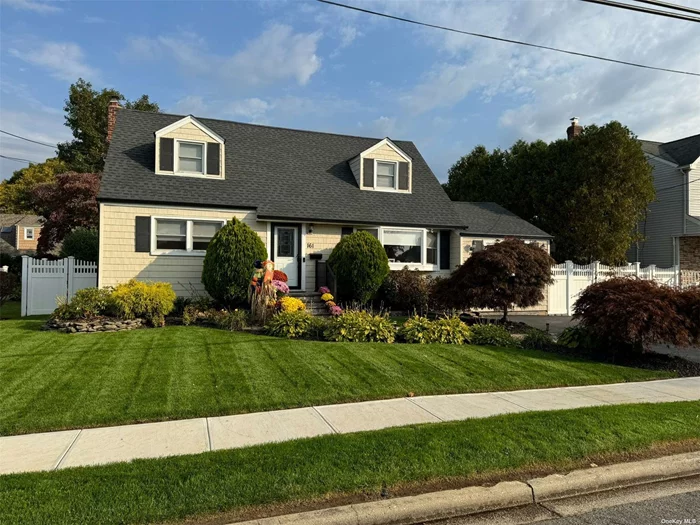 This charming Cape-style home offers 3 Bedrooms & 2 Full Bathrooms in a desirable location. This home was gutted & renovated in 2019. The spacious eat-in kitchen features beautiful wood-look tile floors, an island for extra prep space, gas cooking, granite countertops & stainless steel appliances. The first floor boasts wood floors throughout, a formal dining room, a cozy living room & a Den. Enjoy the built-in surround sound with Bluetooth speakers, LED hi-hat lighting, and outdoor lighting that can change colors to set the perfect mood. A fabulous full finished basement offers space for a media room, playroom, office with a wine fridge and bar area for entertaining with a laundry/utility room as well. Entertain in the private & large backyard with a wooden deck and an 8-zone in-ground sprinkler system to keep the lawn lush and green. The home is equipped with 1-zone CAC, newly protected by a surge protector, 3-zone gas heating & a separate gas HW heater. The roof, plumbing & electrical systems were all updated in 2019, providing peace of mind and modern functionality. Enjoy a new concrete patio, stoop, walkway & sidewalk. Parking is convenient with a 2-car driveway. This home blends classic charm with contemporary upgrades, making it ideal for comfortable living and entertaining.