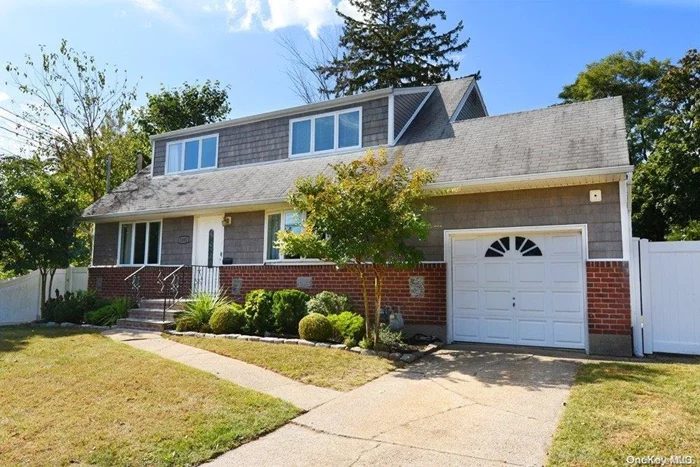 Welcome to this 5-bedroom, 2-bath expanded cape with hardwood floors, formal dining room, additional den or office space, and a large kitchen with gas cooking. Two of bedrooms are on the first floor with three more upstairs. There is a large basement for more gathering space, and the fenced yard offers the chance to enjoy the outdoors, with a French door from the dining room. Basement offers storage space, as does the attic. 220 amp. Private driveway for off-street parking (not a double-yellow lined street).