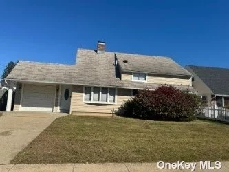 Expanded Cape, Main Level.. Living Room, Eat-In Kitchen Family Room, Kitchen , 2 Bedrooms on first floor, One Bath, and a attached garage. On the second floor, there is 2 Bedrooms with a double fire place. The backyard has an inground swimming, perfect for summer!