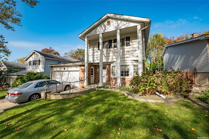 This inviting 4-bedroom, 2.5-bath home offers plenty of space and comfort. The primary bedroom is spacious, complete with a walk-in closet and private en-suite bathroom. The cozy recreation room features a wood-burning fireplace and sliding doors that open to a secluded patio. The formal living room, with its large casement windows, brings in an abundance of natural light and is perfect for hosting gatherings. Additional highlights include beautiful hardwood floors, a modernized heating system, and a finished basement ideal for a home office or recreation area.