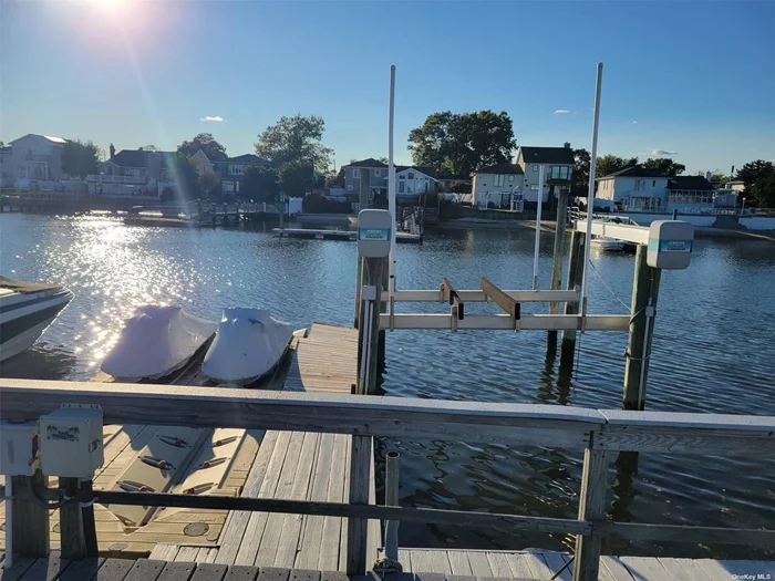 Unique opportunity! Deep water docking with 4 slips! 65 ft wide with storage shed, full fence, boardwalk, working boat lift and 2 jet ski slips. Sitting area and fully upgraded. Minutes to bay, makes it easy to enjoy your water toys living on the water or not- great investment potential for rentable slips as well. Only option of its kind...your own mini piece of paradise! Better and closer than the marinas-access whenever you want!