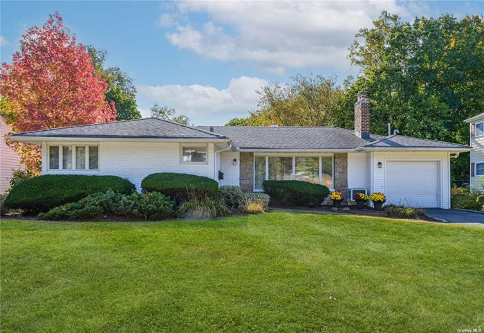 Brick ranch perfectly located in the heart of Eastern Crest is a short distance to town and LIRR. This open floor plan sunlit home has oversized living room with wood burning fireplace, adjoining dining room, eat-in-kitchen, screened in porch plus 3 bedrooms, 1 full bath and 1 half bath. Full Basement with outside entrance to magnificent flat property 75x272. New gas heat, tankless hot water, and gleaming hardwood floors throughout. Endless possibilities!