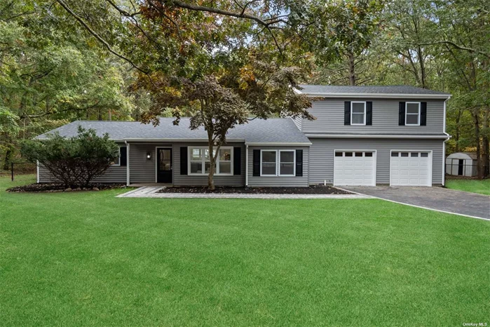 Experience the charm of country living right here on Long Island with this stunning 5-bedroom, 3-bathroom Colonial located in a peaceful cul-de-sac in the heart of Manorville. This 3, 300 square foot home is nestled within the award-winning ESM school district, just two blocks from Rock Hill Country Club. Completely renovated with top-tier finishes, the home welcomes you with sprawling new hardwood floors and vaulted ceilings that enhance its open-concept design. The chef&rsquo;s kitchen is a masterpiece, featuring quartz countertops, a subway tile backsplash, soft-close cabinetry, and brand new stainless steel appliances. The kitchen seamlessly flows into the spacious dining area, flooded with natural light from large windows and sliding doors-ideal for hosting gatherings. The first floor boasts three large bedrooms and two beautifully tiled full baths, each with modern touches like rainfall showers and double vanities. You&rsquo;ll also find an oversized 2-car garage on this level. Upstairs, retreat to the expansive primary en-suite bedroom with vaulted ceilings, a massive walk-in closet outfitted with organizers, and a luxurious en-suite bathroom that will take your breath away. An additional fifth bedroom completes the second floor, perfect for a nursery or guest room. The backyard is designed for entertaining, with nearly an acre of land, a newly remodeled in-ground pool, new decking, and a retaining wall. The list of updates is extensive: new roof, windows, siding, insulation, HVAC, heating system, driveway, flooring, kitchen, bathrooms, pool liner, pool pump, Trex decking, gutters, electrical, and more. This home is the perfect blend of modern luxury and serene living. Don&rsquo;t miss your chance to own this incredible property!