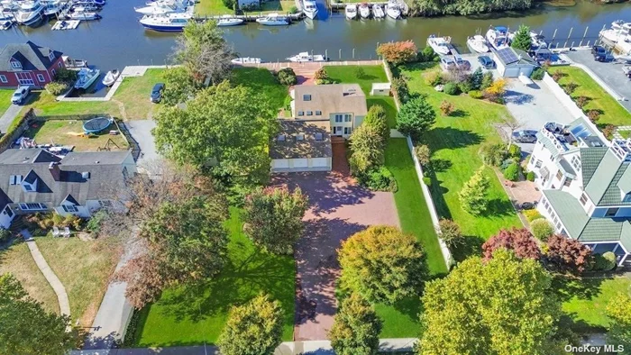 Welcome to this expansive Contemporary home offering 125&rsquo; of prime canal bulkheading. This home boasts cathedral ceilings that enhance the airy open floor plan. The beautifully landscaped backyard complements the picturesque waterfront setting, ideal for hosting gatherings or enjoying serene moments by the water. Don&rsquo;t miss this rare opportunity to own a waterfront gem in South Bay Shore.