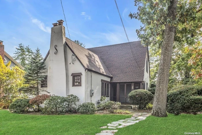 Turn of the Century 3BR/1.5 BTH Tudor in Hewlett Estates Section of Merrick Woods.  Spacious Living Room with Woodburning Fireplace, Cathedral Ceiling, Beams and Built In&rsquo;s, Hardwood Floors as Seen, Slate Floored Front Screened Porch, Formal Dining Room, Eat In Kitchen and Attached Garage. 75x150 Secluded Property in the heart of the &rsquo;Woods with In Ground Sprinkler System, Paver front and Rear Stoop, Gas Stove, Gas Heating, Young Gas HW heater, Washer/Dryers Stays. 150 Amps. SS Refrig, Dishwasher, Pantry in Foyer, 2 year old Roof, Walk In Attic Space plus Schuttle Thru Bedroom Closet, Some updated Windows,  Original Wood Doors and Mouldings .