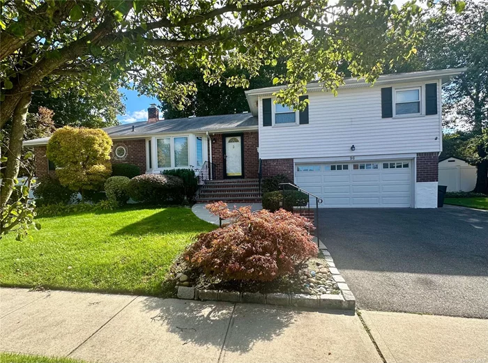 Beautifully renovated, bright and open 4 bedroom, 2.5 split level home in Woodbury Hills section of Plainview. Floors redone, whole house painted and landscaped. Gas heat and cooking, corner house on cul-de-sac. 2 car garage and huge fenced backyard.