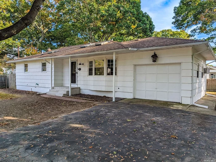 Welcome home to this updated 3 bedroom, 1 full bath expanded ranch in Shirley. Vaulted ceilings and refinished hardwood floors greet you as you enter into the home. The open floorplan consists of the spacious living room, dining room, and beautiful kitchen with granite countertops that also enters into the sunken den. Additionally there are three ample sized bedrooms and a full bath on the main floor. The full unfinished basement has plenty of storage space and an outside entrance. The fully fenced backyard is a great area to entertain or just relax. With taxes under $8k with the STAR credit, you will not want to miss this house!