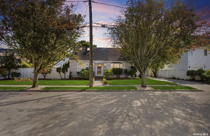 Welcome to 2859 Weeks Avenue an elegant and expanded cape located in Oceanside and close to Rockville Centre. This recently updated and well-maintained home has the potential to be a Mother/Daughter with some updates and proper permits It also has a large room that can be used as a bedroom. The siding is new and artfully done. The interior has been freshly and meticulously painted as you will notice upon entering. There are hardwood floors throughout the first and second floor. The updated kitchen is large enough to dine-in and features a new stove and microwave. The countertops are granite and illuminated by overhead, recessed lighting. There are two bedrooms on the first floor and an en suite on the second floor that boasts a walk-in closet and two skylights. The basement is fully finished and has a separate entrance. The rear-yard has a new deck and playground. Both the front and rear yards feature a lush-lawn, manicured plants, trees and shrubbery that provide for secluded serenity during your leisure time. All this greenery will be well-watered with no effort by you thanks to an in-ground sprinkler system. There is also detached one car garage with a expanded driveway.