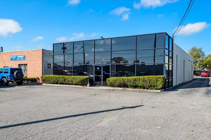 First floor office space with 2 warehouses. Roll down doors, 25 parking spaces.