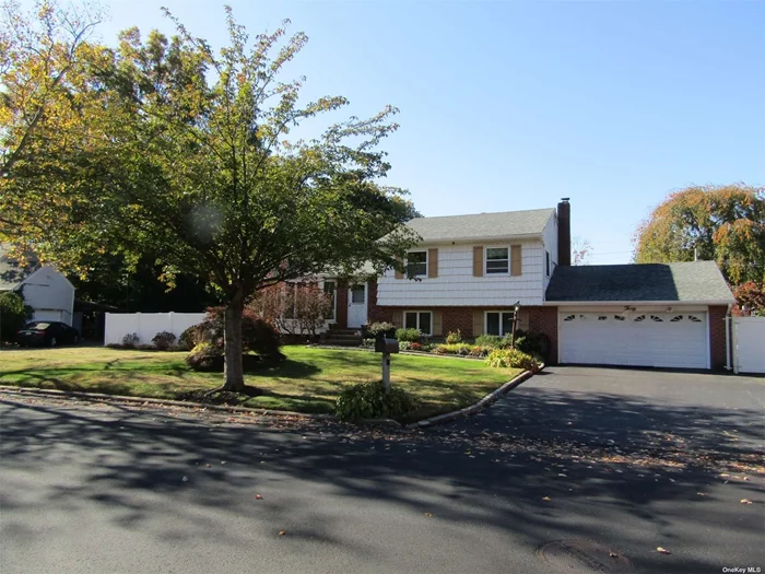 Location, Location, Location! Here is the 3 bedrooms, 2 baths Split level home you have been waiting for in a prime location, situated in the Harborfields School District. In 2013, all the walls, including the basement were stripped and new sheet rock and insulation were installed. New Furnace & Tankless hot water heater installed April 2024, GAS HEAT, mini-splits throughout, some triple pane windows and more updates. The mini-splits provides cooling, and can be considered as a back up heating system also. Magnificent natural light pours into the house from the floor to ceiling windows in the living room and the skylights. The living room flows seamlessly into the dining room; this is perfect for family gatherings and entertaining. The den/family room offers a wood burning fireplace, 1/2 bath, and exits to a patio with pavers, or to the 2 car garage. The eat -in -kitchen is renovated and boasts granite counter tops, contemporary white cabinets, top-of-the-line stainless steel appliances, skylight and a new slider which opens to a large TREX deck in the backyard. The backyard is an entertainers delight! It is an oasis with an inground 16x32 pool surrounded by endless pavers Is the focal point on the South side of the yard, a patio with pavers on the North Side of the yard, and the large deck off the kitchen. The den/family room offers a wood burning stove, 1/2 bath, and exits to a patio with pavers, or to the 2 car garage. It is a mere 6 minutes to the Long Island Railroad. This home offers comfort and convenience, making it the perfect place to settle in and create lasting memories.