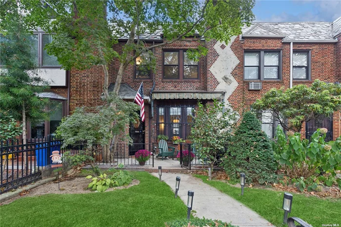 Enter into timeless elegance with this beautifully renovated 3-bedroom Tudor townhouse, designed by the renowned Wolosoff Brothers, perfectly blending classic charm with contemporary comfort. The living room invites you in with a cozy corner fireplace, hand-hewn beamed ceiling. and a warm, welcoming ambiance. Adjacent to the living space, the raised original wood-paneled dining room exudes historical character, while the designer eat-in kitchen boasts a stylish farm sink, stainless steel appliances, and sleek cabinetry-ideal for culinary enthusiasts. The home&rsquo;s layout includes a powder room on the main floor and a beautifully renovated hall bath upstairs. The primary bedroom offers a private terrace, a relaxing spot for morning coffee or watching evening sunsets. Two additional generous bedrooms complete the second floor. The fully finished basement features a spacious recreation room, ideal for entertaining or relaxation. It also includes a luxurious second full bath, complete with a sleek glass-enclosed shower with elegant marble tile accents, as well as a dedicated laundry area. A door to the back area allows easy access to the garage. Additional highlights include hardwood floors throughout, split air conditioning systems, an attached one-car garage and a driveway with room to park a second vehicle, and a charming front patio with landscaped gardens. Located in the heart of Forest Hills, this residence offers both luxury and convenience in a prime neighborhood setting.