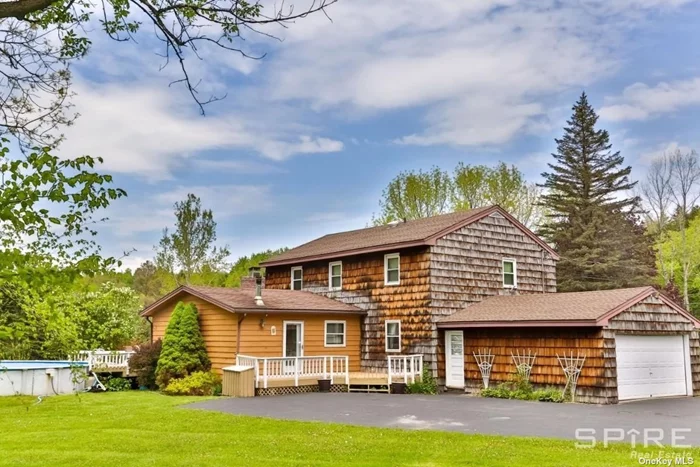 WELCOME TO THE MID-CENTURY WINDHAM ART HOUSE WITH LUXURIOUS YEAR-ROUND HOT TUB, OUTDOOR SEASONAL SWIMMING POOL, WALL-TO-WALL FIREPLACE, CUSTOM BAR, 2.7 ACRES LAND WITH PRIVATE CREEK AND MORE! This gorgeous 5 bedroom 2.5 bath home of nearly 3, 000 sq ft offers so much: NATURE and PRIVACY, beautiful lawns, a creek, huge trees; RELAX and ENTERTAINMENT, swimming pool, hot tub, fireplace, bar, grill, Smart TVs, ART paintings & furniture. A queen size bedroom with reclining bed frame and a high-end mattress in the bedroom on the first floor is convenient for people who don&rsquo;t want to do stairs. The kitchen is very large with dishwasher, double fridge with ice maker, gas oven, programmable coffee machine, microwave. toaster mini oven, juice and smoothie makers, kitchen island with cutting board and a lovely view to the patio. The surrounding nature will make you feel relaxed and rejuvenated. There are a casual and a formal dining rooms which sit 14 people total. The patio has a gas grill as well. Two living rooms offer completely different feel. The Den is all wood-enclosed and features wall-to-wall wood burning fireplace, custom bar with mini-fridge and ice machine, leather sofas, a Lazy Boy and and a 70-inch brand new smart TV, while the sliding doors lead to your patio with a brand new hot tub with blue tooth speakers and stunning mountain views. In the summer you can enjoy the private 30 ft swimming pool as well. The second living room which we call The French Salon features Mid-Century furniture, 50-inch smart TV and board-games + a growing library.