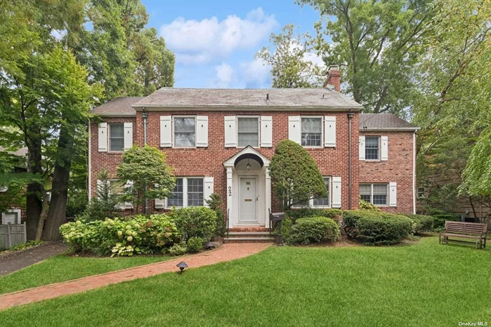 Introducing this elegant brick home, boasting 4 spacious bedrooms and 3.5 baths. The property seamlessly blends timeless architectural charm with modern amenities. Its open-concept design connects the den, living, and dining areas, complete with a cozy fireplace and a built-in library. The large eat-in kitchen leads out to a delightful backyard porch, perfect for outdoor relaxation. The first floor showcases beautiful hardwood flooring, a convenient bedroom, a full bathroom, and a powder room. On the second floor, the expansive primary suite features two walk-in closets and a newly renovated en-suite bath, complemented by two additional bedrooms with ample closet space and a shared full bath. The finished basement offers exceptional versatility with an additional bonus room, a home office, a laundry room, and ample storage, alongside a boiler room. The property also includes a long driveway and a one-car garage, providing both convenience and privacy. This home is a perfect blend of comfort, functionality, and classic appeal, ideal for modern living.