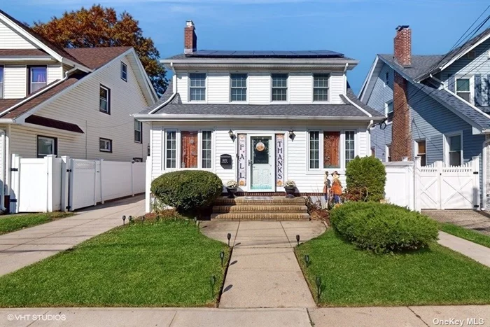 Located in the heart of Saint Albans. It is a meticulously curated home blending historic elegance and modern comfort. Expertly maintained, the home showcases a sun-drenched foyer, spacious formal living room with a wood-burning fireplace, and a grand dining room. The large kitchen includes stainless steel appliances with pantry for storage. A half bath a versatile room that can be used as an office or kids playroom. Upstairs, four well-appointed bedrooms provide comfort and privacy. The finished basement with a separate entrance includes a full bath, laundry room and additional living space that can be used for guests. The beautifully landscaped yard and large deck create a serene outdoor retreat. The home features a one-car detached garage and is equipped with ductless A/C throughout, ensuring comfort in every season. The home also features solar panels (fully paid off) and an Electric Vehicle charger. In ground sprinklers, new windows, roof and fenced yard makes this a much see property! Ideally located, the home is just a 5-minute walk to the LIRR, making it perfect for commuters. In pristine, move-in ready condition. This is definitely a rare gem in one of Saint Albans most sought-after neighborhoods private block, offering unmatched beauty, style, and location for its next discerning owner.