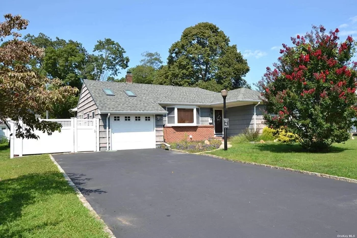 This beautifully maintained home features a new energy-efficient central air conditioning system with a SEER rating of 12+. The large eat-in kitchen boasts granite countertops, perfect for casual dining and entertaining. Enjoy the bright and spacious family room with two skylights that fill the space with natural light. The formal dining room and hardwood floors throughout add a touch of elegance. The full, unfinished basement offers ample storage or potential for future expansion. Additional amenities include wiring for an electric vehicle (EV) charging hookup and natural gas heating.