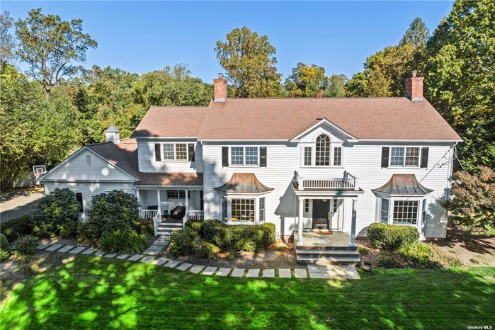 Stunning Classic Colonial situated on a tree-lined country lane in Lloyd Harbor. A beautiful residence that has been freshly painted inside and out with generously proportioned rooms and high ceilings throughout. Sunlight streams throughout each room and creates a very warm and inviting atmosphere. Gorgeous mill work, including coffered ceilings, gleaming hardwood floors and interior French doors are a few of the fabulous details. Smart home features with one touch operation from your phone, including surround sound and alarm system. Wonderful over-sized kitchen with large pantry and grand island which flows seamlessly to the family room-- ideal for entertaining. Abundant closet space! Expansive FLAT property, imagine your own personal soccer field! Also a heated, salt water in-ground pool. Absolutely gorgeous English style conservatory which overlooks the property is a four season space. New top of the line burner, ac compressors, new well water filtration system, new marble bath, Private Police and Lloyd Harbor Park includes beach, tennis & mooring (fee). Private Road Assoc. (fee) CSH SD#2, Just minutes to Cold Spring Harbor and Huntington Village.