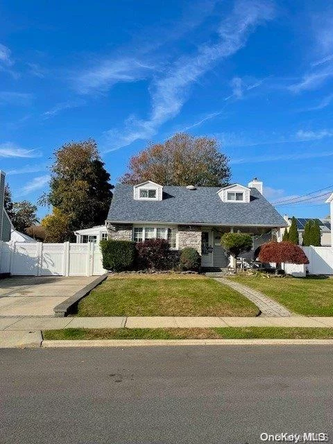 Large Cape featuring 5 bedrooms, 3 full baths, sunroom, new roof, 2 car detached garage, full finished basement with outside entrance. Storage shed in private, fenced back yard.