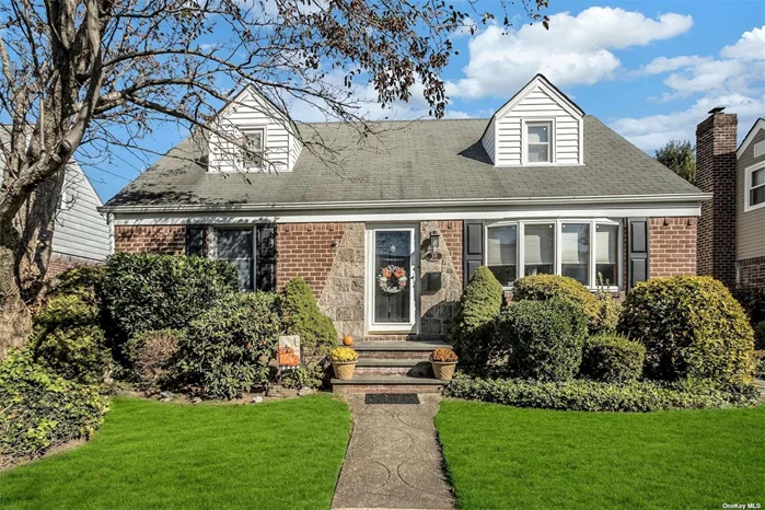 Welcome to this quintessential Westwood North Valley Stream expanded Cape. This home is located in a cul-de-sac, and its beautiful curb appeal and impeccably maintained interior, exude pride in ownership. This home boasts a fabulous expanded eat-in kitchen with vaulted ceilings, custom wood cabinetry and a gas stove. The Kitchen leads to a meticulously landscaped and fenced in yard with a large wood deck and gazebo area - perfect for entertaining. The main level of this home features hardwood floors in the spacious living room and adjoining and expanded formal dining room. The first level also includes two nicely sized bedrooms and a full bathroom. Upstairs are two additional spacious bedrooms. The full finished and carpeted basement offers plenty of storage, along with a den/entertainment area, laundry room, with an easy access laundry shoot, and cedar closet. Other fabulous features of this home include central air conditioning, alarm system, in ground sprinklers, 50 X 100 lot, a long driveway leading to a large detached two car garage and the home is .7 miles from the nearest LIRR station. This home is a must see!!