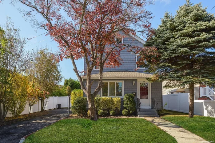 Charming, newly updated colonial home in the heart of Locust Valley. Featuring a modern granite kitchen with stainless steel appliances and gas cooking. Enjoy meals in the formal dining room, and relax in the expansive living room, all with beautiful hardwood floors throughout. The large, fenced-in yard with a deck, and dining table, perfect for outdoor gatherings. Conveniently located near shopping, restaurants, the railroad, and the stunning town beaches.