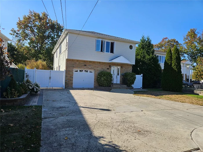 Herricks School District. Built in 1991 with updated kitchen. Over 8000 sf lot size with brick paver patio around the house. This unique house features a total of 5 bedrooms and 4 full bathrooms with 2, 300 sf of above grade living space suite for large family or shared with two families. The finished basement has separate entrance and can be extra living space or potential income. The kitchen is equipped with island, granite counter top, five doors modern refrigerator, and a double oven GE profile stove. One car built in garage with 4-car parking spaces in the front. Three hot water heating zoning for each floor. Central air cooling system for above grade area.