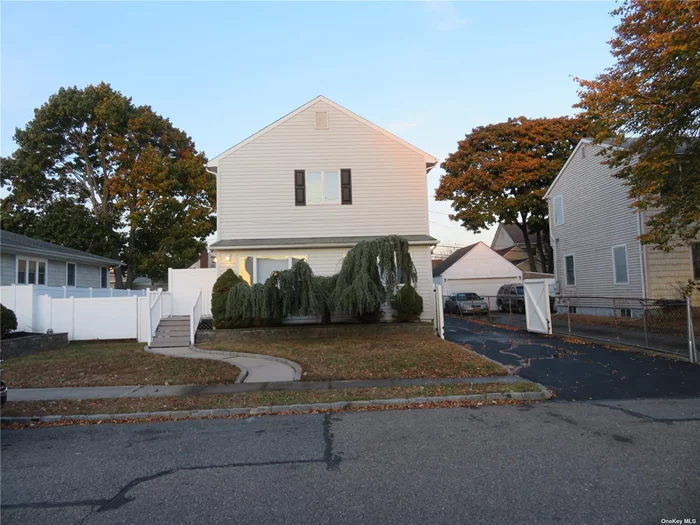 Totally Renovated From top to bottom. This spacious colonial offers open floor plan, It features all the amenities your Heart desires. New white oak kitchen with quarts tops & stainless steel appliances, It also includes a 36 inch stove and a built in vented microwave. It also has an oversize center island with quarts top for your dining pleasure. Polished oak floors through. 10 foot ceiling with hi hats galore. The family room features a wood burning stove for those cold winter nights. Master Bedroom has Jack & jill Bath with walk in closet. Ceiling fans in all room. The basement is ready for finishing touches with a Tankless water heating system and washer & dryer. The yard is well manicured with mulch. This home has a 4 car driveway & a 11/2 Gar detach garage with workshop. Walking distant to the beach & the great south bay.