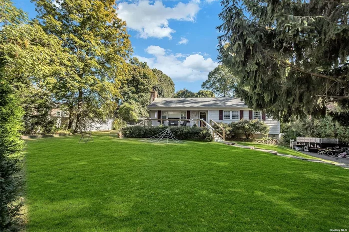 This Setauket sun-lit 3 bedroom Ranch offers great indoor and outdoor space. Beautiful built-ins surrounding the fireplace add great character to the living room while the open space adds a modern feel to the spacious kitchen. Sliders lead out to a great deck overlooking the yard. The lower level offers many possibilities. Close to Stony Brook Village, shopping, schools, park and transportation.