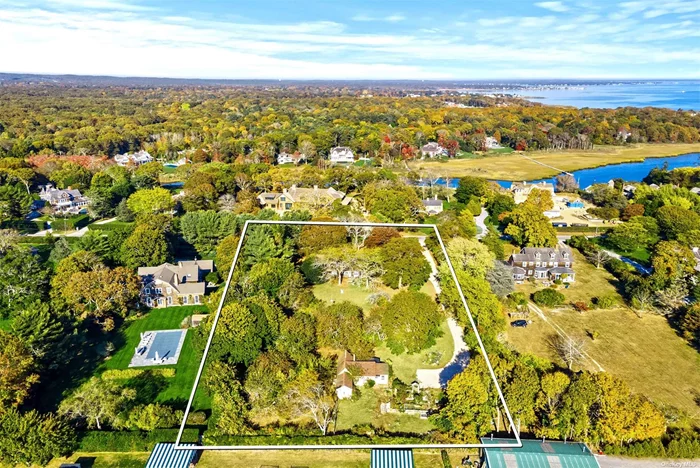 Offered for the first time in generations, this 1.98 acre property presents a rare opportunity to build your dream Quogue estate. Whether the vision is a modern masterpiece or a traditional retreat, this property allows for multiple residences providing an ideal canvas. The sprawling premises consists of a main house, guest cottage, 900 sq ft barn, one car garage, and a tool shed. The Cape-style main house features a living room, dining room, kitchen, four bedrooms, three baths, and attached two car garage. The charming guest cottage includes a full kitchen, living room, dining area, three bedrooms, full bath, and detached one car garage. There&rsquo;s ample room for a pool and tennis court. This desirable location, on one of the most prestigious streets in Quogue, is home to the Shinnecock Yacht Club and many of the exquisite summer cottage estates dating back to the 1800&rsquo;s.