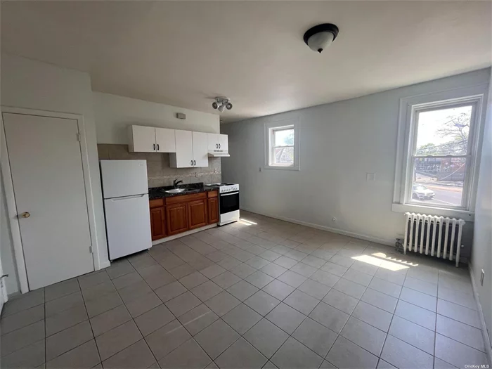 One Bedroom, one bath unit on the second floor of a mixed use building. Spacious living room and bedroom, updated bathrrom, plenty of closets.