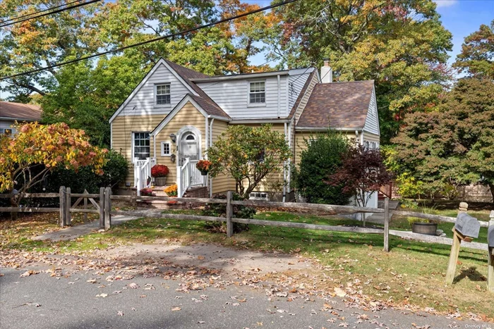 Set in beautiful Sound Beach just moments from the coast, local beaches, marinas and fishing, local parks, restaurants and the Long Island Pine Barren Preserve discover this charming 3-bedroom home boasting oodles of midcentury charm. It exudes character from its original arch top front door, the pine-lined foyer, hardwood floors and authentic 2 panel doors and hardware. The converted 3 season room creates an ideal space for an afternoon of relaxing with its vaulted ceiling line and separate outside entrance to the rear deck. The large deck with dual-sided stadium staircase was overhauled in 2021 and offers ample room for entertaining and barbequing or take a seat to catch the breeze from the LI Sound less than 2 miles away. 1st floor bedroom and bathroom offer convenience and a formal dining room off the galley style kitchen can accommodate 6+ seats. Floor 2 is made up of bedroom #2 & #3 with walk-in closet as well as a second bathroom. The new architectural roof was just installed in September and is complimented by durable aluminum siding and updated dual-pane windows. The basement offers utility and function with storage, mechanicals, laundry machines, and a double steel door that opens out to the ground level patio. Bonus storage is found beneath the den with exterior access. Beach rights, lots of charm and a lovely .23 acre lot with taxes under $6, 700 give every reason to make this your new home!